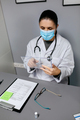 Female doctor working with transparent tablet in office - PhotoDune Item for Sale