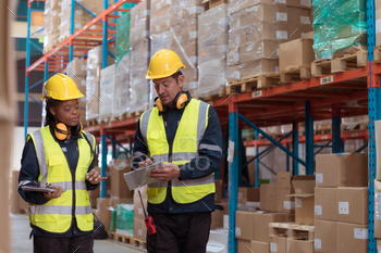 Warehouse foreman and employees Check the imported products in the central warehouse.