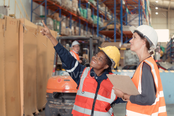 Warehouse foreman and employees Check the imported products in the central warehouse