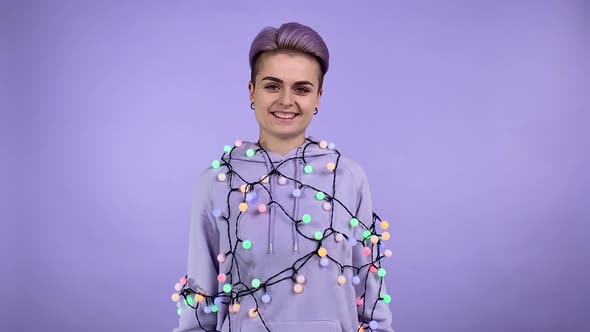 Young Woman Hung Festival Lights Changing Facial Expression Indoors