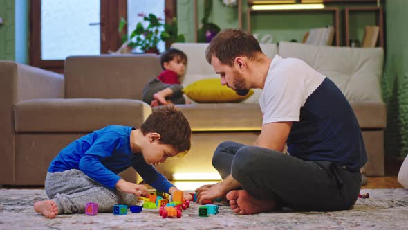 Dad with His Big Son Playing Together While