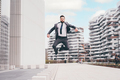 Energetic young bearded professional businessman jumping in mid-air - PhotoDune Item for Sale