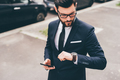 Young professional elegant bearded businessman checking time - PhotoDune Item for Sale