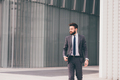 Confident and professional elegant bearded businessman walking outdoor - PhotoDune Item for Sale