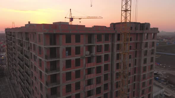 Construction Site in the Middle of the City and Private Houses at Sunset in .