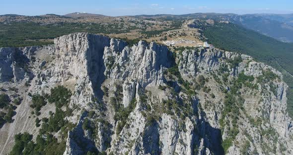 Aerial View on Crimea Nature, Rocks and Mountains. Flying Close To Huge Rock Cliff. Crimea Landscape