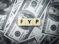 Toys word and banknotes with the word FYP. Busienss concept. - PhotoDune Item for Sale