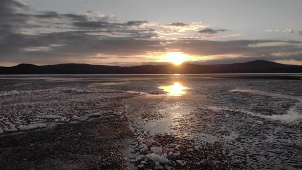 Aerial View of Sunset Over the Frozen Winter Sea