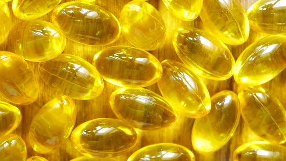 Fish Oil Supplement on Orange Background alt