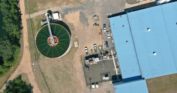 Top Aerial View of Purification Tanks of Modern Wastewater Treatment Processing Plant Near Solar