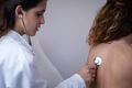 Doctor visits patient in her office. - PhotoDune Item for Sale