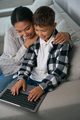 Boy is typing at home on laptop - PhotoDune Item for Sale