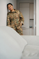 Beautiful military woman stands in living room against the wall - PhotoDune Item for Sale