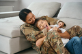 Woman soldier with her beloved son teenager at home - PhotoDune Item for Sale