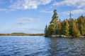 Beautiful blue lake and shore with pines in the Boundary Waters of Minnesota on a fall morning - PhotoDune Item for Sale