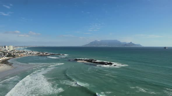 blue ocean waves at Big Bay Beach, Cape Town South Africa, aerial