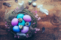 Happy Easter - nest with Easter eggs on wooden background with copy space - PhotoDune Item for Sale