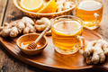 Ginger tea with lemon on a wooden table - PhotoDune Item for Sale