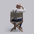 Disappointed filmmaker sitting on the director's chair - PhotoDune Item for Sale