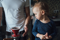Father teaches his daughter to cook at home in the kitchen. Dad makes coffee at home. - PhotoDune Item for Sale