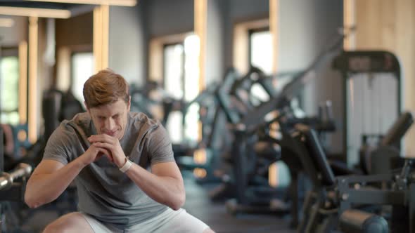 Strong Man Making Crossfit Warm Up at Gym. Sportsman Doing Squats in Sport Club alt