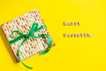 Celebrating the traditional Jewish holiday of Passover. Matzo on a yellow background. Pesach matzah. - PhotoDune Item for Sale