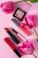Set of cosmetics and flowers on a pink background. Makeup and beauty products. - PhotoDune Item for Sale