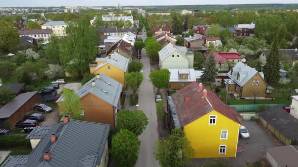 Drone shot over Karlova colorful wooden houses in summer time