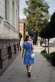 Woman in a blue dress walking on the city street - PhotoDune Item for Sale