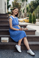Pregnant woman touching her belly while sitting and resting - PhotoDune Item for Sale