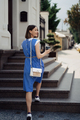 Pregnant woman walking through the city in a blue dress - PhotoDune Item for Sale