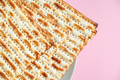 Happy Passover. Matzo on a pink background. - PhotoDune Item for Sale