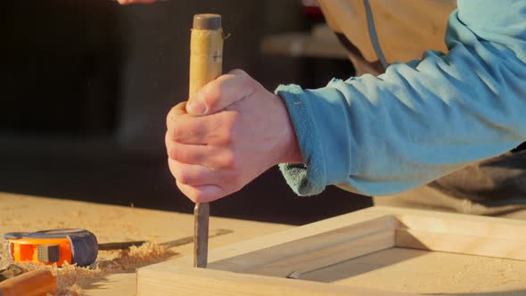 Carpenter carving wood