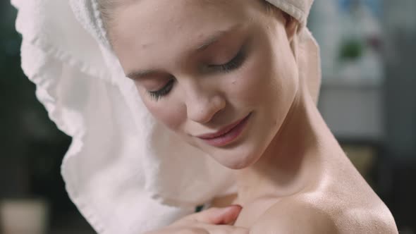 Beautiful Woman Applying Creams On Skin After Shower