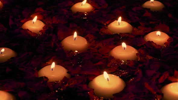 Candles And Rose Petals Floating In Spa