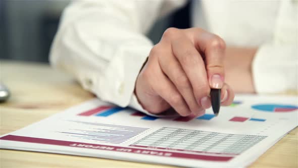 Businesswoman Doing Finances in Office