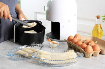Cooking Proces Using White Air Fryer for Healthy Cooking in the Kitchen.
