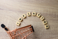 Inflation words on shopping trolley. Crisis and rising commodity prices concept. - PhotoDune Item for Sale