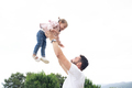 Playful dad lifting on the air her little daughter - PhotoDune Item for Sale