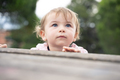 Low angle of a curious and cute little girl outdoors - PhotoDune Item for Sale