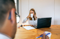 Woman with headset in customer help service taking a break and drinking cup of coffee - PhotoDune Item for Sale