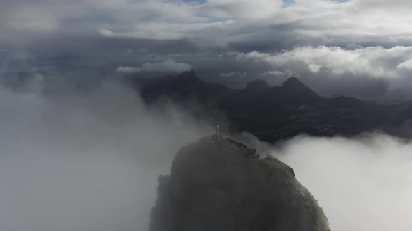 Aerial view of a person standing on Le Pouce Mountain, Mauritius.