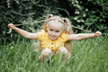 Summer activities and connecting with nature for kids. Cute little girl with two ponytails runs - PhotoDune Item for Sale