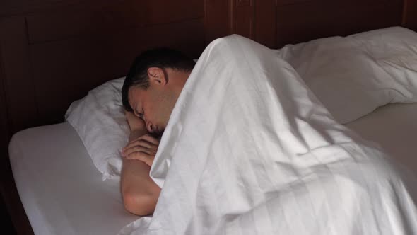 Man Sleeps In Bed In Dark, Quickly Getting Light, Light Interferes With Sleep