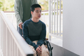 Concept of Family Caregiving in everyday life for happy teenage boy with disability on wheelchair. - PhotoDune Item for Sale