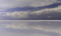 Stormy sky and reflections of clouds in shallow water of Salar de Uyuni - Altiplano, Bolivia - PhotoDune Item for Sale