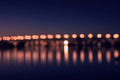 Background with blurred lights of lanterns at night. reflection of bokeh in river. Toulouse, France - PhotoDune Item for Sale