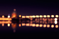 Background with blurred lights of lanterns at night. reflection of bokeh in river. Toulouse, France - PhotoDune Item for Sale