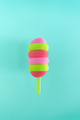 Colored ice cream popsicle on a pastel mint background. Minimal summer concept - PhotoDune Item for Sale
