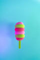 Colored ice cream popsicle on a pastel mint background. Minimal summer concept - PhotoDune Item for Sale